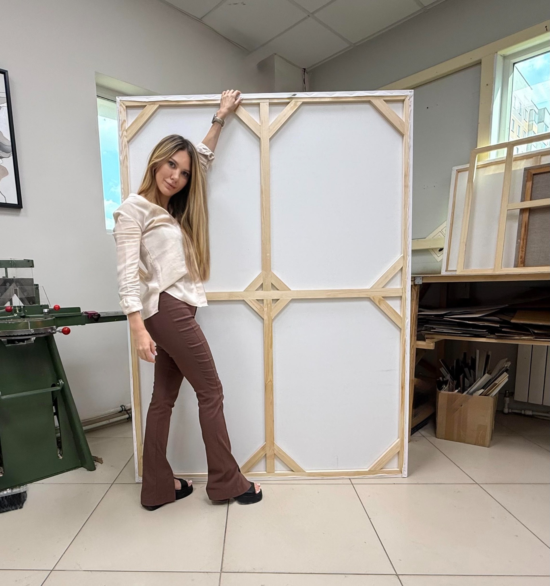 Lyubov Shelest in her framing workshop